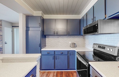 Maple City Condo | Bayfront condo with lake & bay views, deck, 2 fireplaces, private washer/dryer