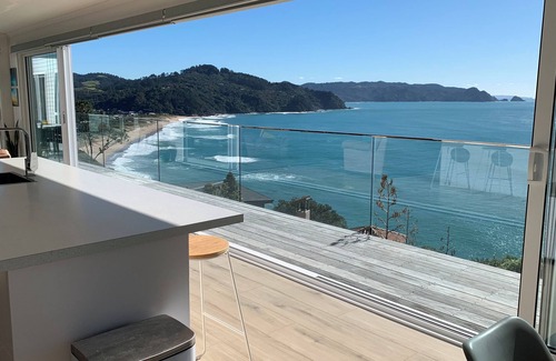Tairua House | Beach and ocean views in every room.