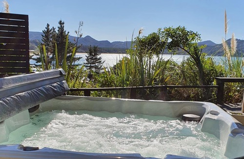 Kennedy Bay House | Beach, Bush, Birdsong and stunningly Beautiful views...with a touch of luxury.