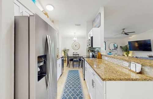 Naples Park House | Beach home with outdoor sundeck, hot tub, enclosed yard & patio