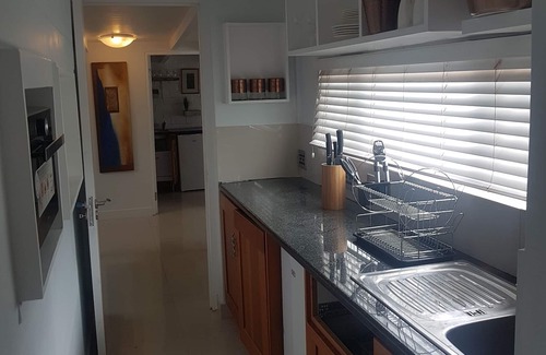Gordons Bay Central Apartment | Beach on Antilles - Sandy Toes and Relaxation just steps away from your room