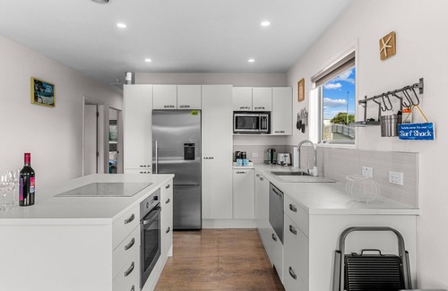 Mangawhai Heads House | Beach Time - Modern, sunny home close to amenities, a great place to relax and watch the kids play