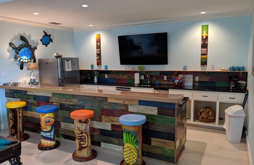 Sand Point House | “Beach Views—Shell Yeah! Beach House is your stylish, fun-filled coastal escape with private bathrooms & neighborhood pool-Just steps from the sand!”