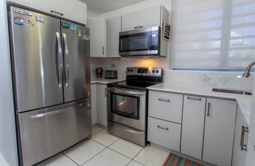 Ensenada House | Beachfront in gated community with patio, balcony, pool, close to all in Rincón