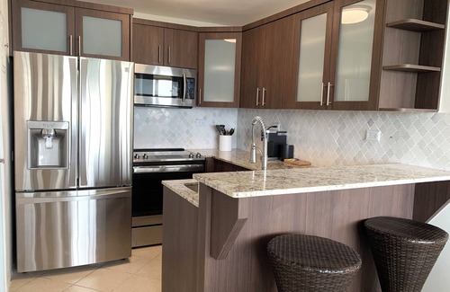 San Juan Apartment | Beachfront Oceanview 2-suite condo with balcony, AC, WiFi, Pool, Fitness Room