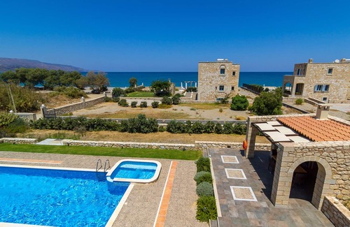 Rapaniana Villa | Beachfront Stone villa with private pool, 30m to the Ocean, BBQ & Hydromassage