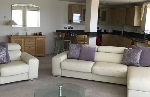 West Bay Apartment | Beachside, stunning apartment with sea and harbour views