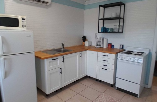 George Town Apartment | Beachy apartment a few minutes walk to multiple beaches, including Jolly Hall!