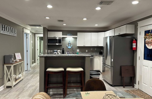 Highland City Apartment | Beachy Poolside Palm nestled between PCB, Mexico Beach and downtown PC.