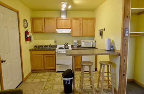 Kodiak Apartment | BEARS, BIRDS, AND WHALES. n Room 1 with a Car