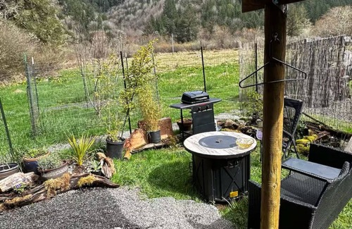 Reedsport Cabin | Beautiful cabin with view of garden, coastal hills and elk