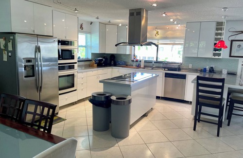 Whispering Pines House | Beautiful Canal Front Heated/Chilled Pool 4 Bdr Home