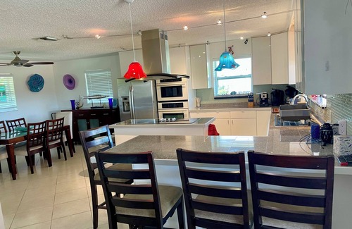 Whispering Pines House | Beautiful Canal Front Heated/Chilled Pool 4 Bdr Home