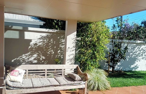 Kiama Apartment | Beautiful eclectic studio with lush private garden and solar heated pool