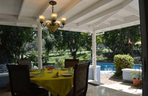 Runaway Bay Villa | Beautiful garden villa. Family friendly. Just a short walk to a private beach.