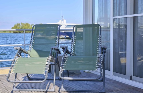 Kerkdriel Boat Rental | Beautiful houseboat in harbour of Kerkdriel