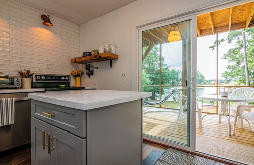 North Shore Acres House | Beautiful lake front cottage, deep water lot with covered dock and amenities.