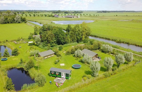 Enumatil Cabin | Beautiful furnished safari tent and circus wagon with private bathroom.