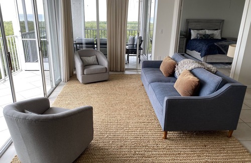 Pelican Bay Condo | Beautiful sunset views of the Gulf from this western facing 9th floor condo.