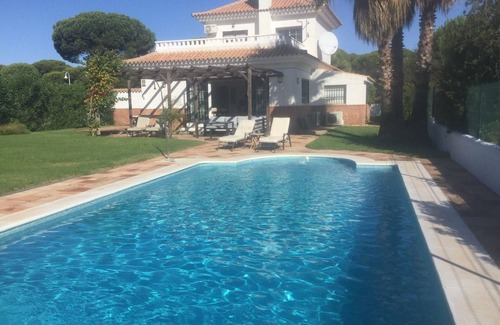 Nuevo Portil Villa | Beautiful villa , close to the beach . Secluded garden with private pool.