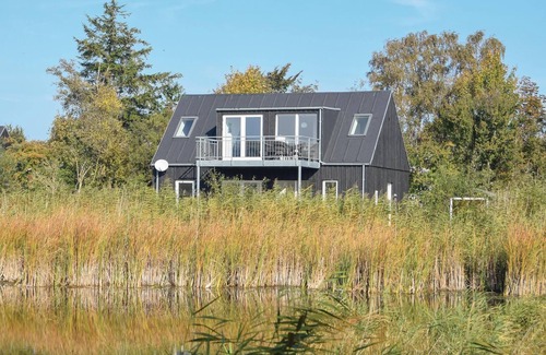 Østerskov House | Beautiful wooden house on the east coast of Langeland, in the Bukkemose area.