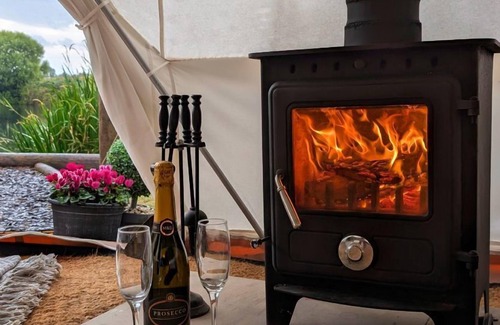 Washford Cabin | Bell tent in ultimate luxury with a wood fired hot tub, super king size bed