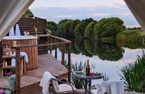 Washford Cabin | Bell tent in ultimate luxury with a wood fired hot tub, super king size bed