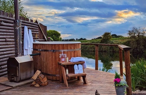 Washford Cabin | Bell tent in ultimate luxury with a wood fired hot tub, super king size bed