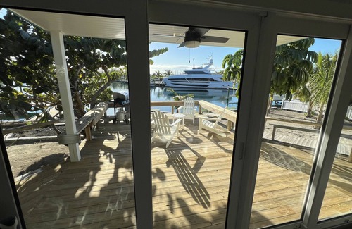 Treasure Cay House | Big Yellow House with Dock on Deep Water Canal and Dock Power Available