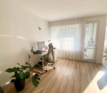 Siska District Apartment | Black & White Hideaway with garage