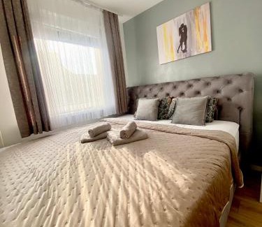 Siska District Apartment | Black & White Hideaway with garage