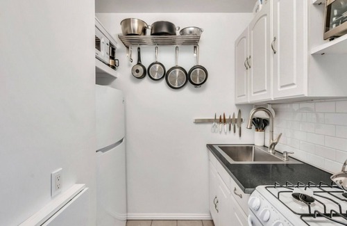 Montauk Apartment | Bohemian-style hotel unit with ample natural light, a cozy seating area,.