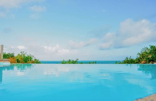 Trou d'Eau Douce Villa | Boutique Villa on the Rocks with Stunning Sea Views,Infinity Pool &Private Jetty