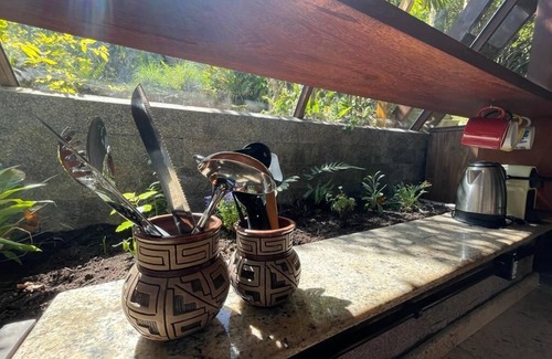 Florianopolis Cabin | Pyramid house covered in quartz. Space for healing and regeneration connections.