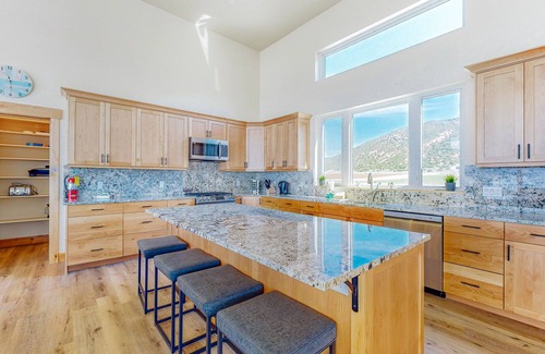 Laketown House | Brand-new lakefront home with private beach, mountain views, fireplace & deck