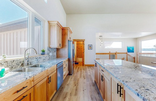 Laketown House | Brand-new lakefront home with private beach, mountain views, fireplace & deck