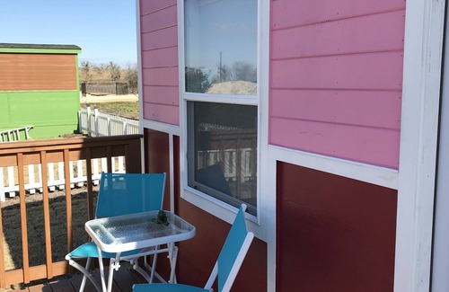 Buda Cottage | "Breakfast at Audrey's" Mini Home located next to Drive In Theatre!