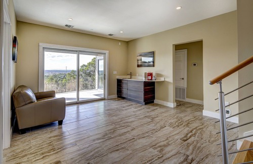 Lost Creek House | Bridge to Happiness: Cross the entry bridge into a gorgeous 4 bedrooms residence