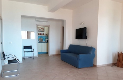 Santa Reparata Apartment | Bright one-bedroom apartment with sea view a few steps from the beach