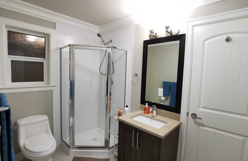 Coquitlam House | Bright suite with two bathrooms for added convenience and privacy.