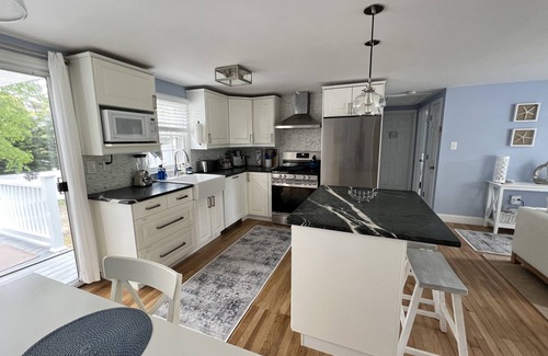 South Yarmouth Cottage | Bright, updated cottage only 1.6 mi to beaches Large private yard w/2 Tier deck.
