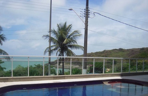 Guarapari Apartment | Building facing elegant Bacutia beach (Blue Cove)