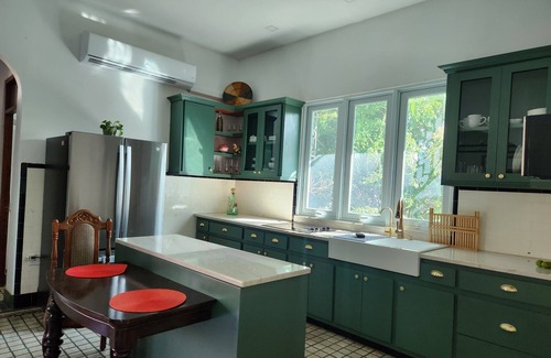 Arecibo Pueblo House | Built in 1942 and recently restored. Natural light and green lush vegetation.