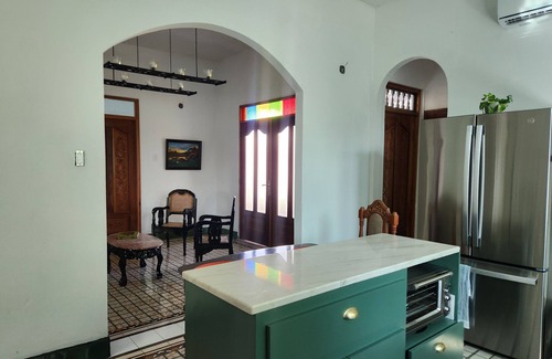 Arecibo Pueblo House | Built in 1942 and recently restored. Natural light and green lush vegetation.