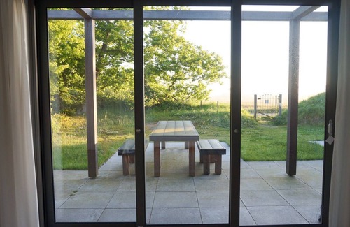 Ouddorp House | Bungalow in a unique place where nature and design are intertwined, with a large garden.