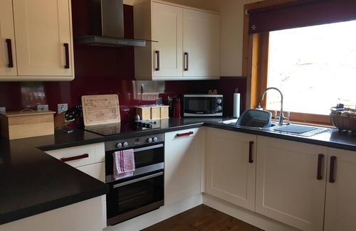 Banavie Ski Chalet | Burnside Lodge, overlooking river Lundy, backdrop of Ben Nevis and Nevis Range.