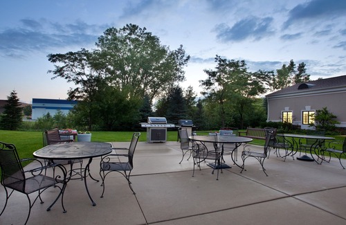 Half Day Condo | Business District Suite with Pool Access, Free Breakfast + Weekday Shuttle