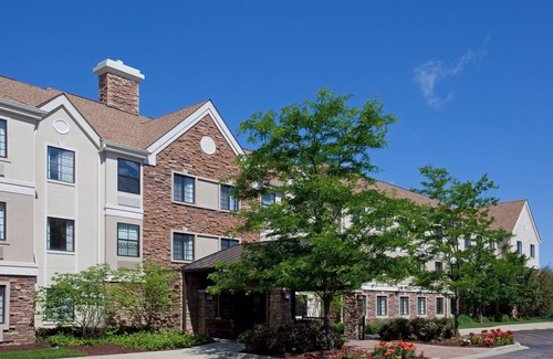 Half Day Condo | Business District Suite with Pool Access, Free Breakfast + Weekday Shuttle