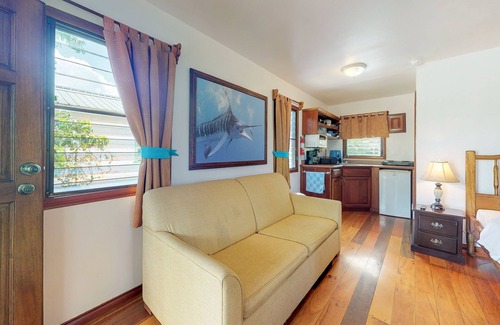 Hopkins Apartment | Cabana with a porch, hammock, & view of the pool & grilling area
