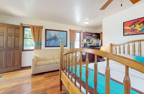 Hopkins Apartment | Cabana with a porch, hammock, & view of the pool & grilling area